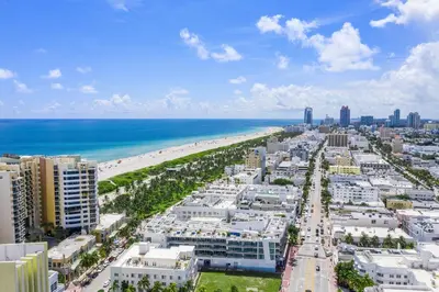 an aerial view of a beach and the ocean at Penthouse De Soleil South Beach - on Ocean Drive Miami Beach in Miami Beach