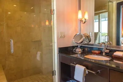 a bathroom with a sink and a shower at Penthouse De Soleil South Beach - on Ocean Drive Miami Beach in Miami Beach