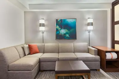 a living room with a couch and a table at Hyatt Place Ft. Lauderdale/Plantation in Plantation