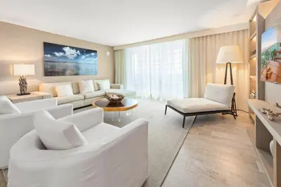 a living room with white furniture and a large window at Oceanview Private Condo at 1 Hotel & Homes -915 in Miami Beach