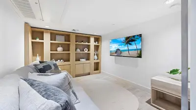 a living room with a tv on a wall at Oceanview Private Condo at 1 Hotel & Homes -904 in Miami Beach