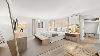 a hotel room with a bed and a mirror at Oceanview Private Condo at 1 Hotel & Homes -904 in Miami Beach
