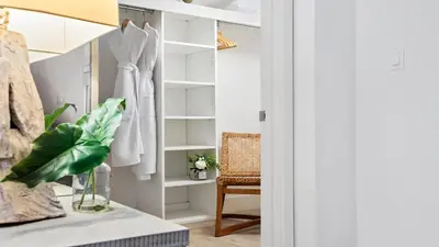 a closet with a dress hanging on a rack at Oceanview Private Condo at 1 Hotel & Homes -904 in Miami Beach