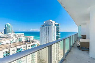 a balcony with a view of the ocean and buildings at 2 Bedroom on 17th floor on the beach Resort in Hallandale Beach