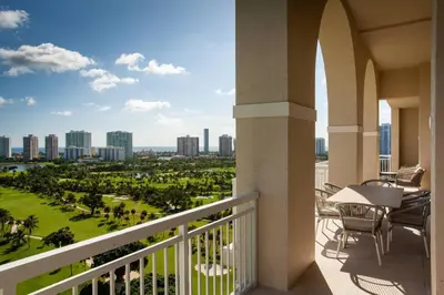 a balcony with a view of the city at JW Marriott Miami Turnberry Resort & Spa in Aventura
