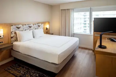 a hotel room with a large bed and a television at Hampton Inn & Suites by Hilton Miami Downtown/Brickell in Miami