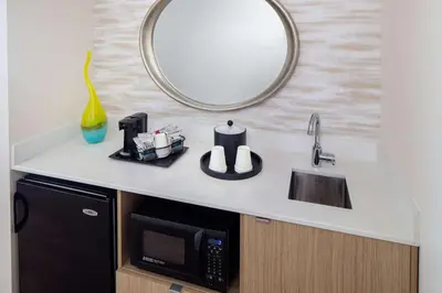 a kitchen counter with a microwave and a sink at Hampton Inn & Suites by Hilton Miami Downtown/Brickell in Miami