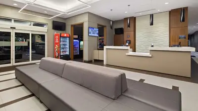 a lobby with a couch in the middle of a store at Best Western Plus Miami Intl Airport Hotel & Suites Coral Gables in Miami