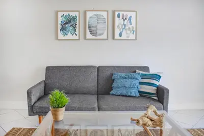 a living room with a couch and a coffee table at Coral Reef at Key Biscayne in Miami
