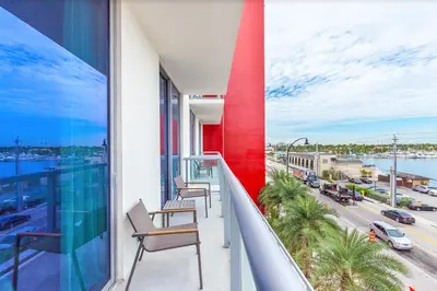 a balcony with chairs and a view of a city at Global Rent Apart - Costa Hollywood in Hollywood