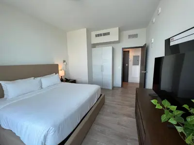 a bedroom with a bed and a flat screen tv at Global Rent Apart - Costa Hollywood in Hollywood