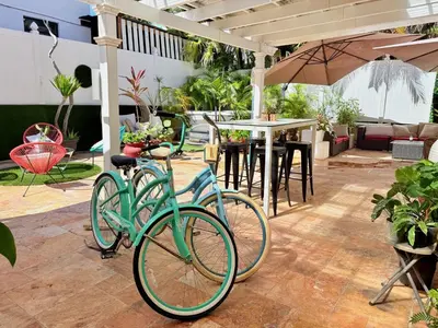 two bikes parked in a patio with an umbrella at Sinclair Boutique Hotel in Hollywood