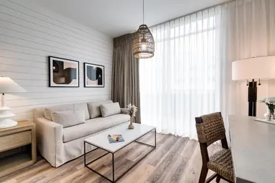 a living room with a couch and a table at Boulan South Beach in Miami Beach