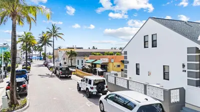 a city street with cars parked on the street at Lofted Apt wQueen Loft Nook steps to Beach in Hollywood