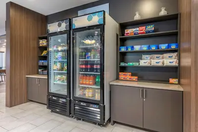 a large refrigerator with its doors open in a store at Comfort Suites Fort Lauderdale Airport & Cruise Port in Dania Beach