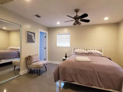 a bedroom with a bed and a ceiling fan at Lakefront Vacation Home - Sleeps 8 in Davie