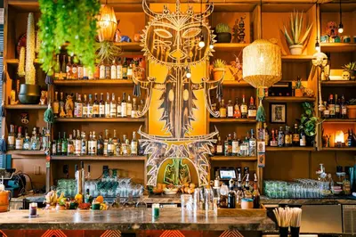 a bar with a lot of bottles of alcohol at Generator Miami in Miami Beach