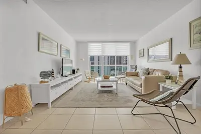 a living room with a couch and a tv at THE TIDES 2bedrooms apt 14th floor WE ARE ON THE BEACH! in Hollywood