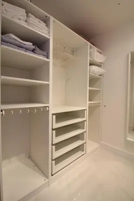a white walk in closet with white shelves at Yacht Club at Aventura 1 Bd 1 Bth Brand New in Aventura