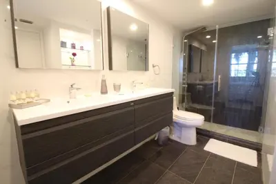 a bathroom with a sink and a toilet and a shower at Yacht Club at Aventura 1 Bd 1 Bth Brand New in Aventura