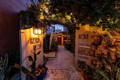 an entrance to a garden with plants and lights at The Desoto - Oceanview Inn in Hollywood