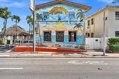 a building with a painting on the side of it at Ocean Villas in Hollywood