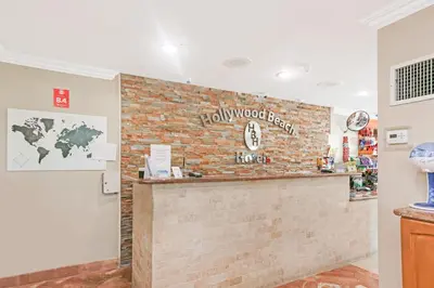 a brick wall with a bar in a room at Ocean Villas in Hollywood