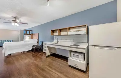 a kitchen with a sink and a refrigerator at Extended Stay America Premier Suites - Miami - Airport - Doral - 87th Avenue South in Miami