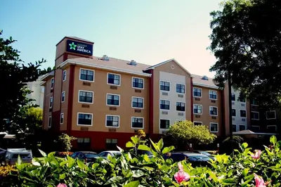a building with a clock on top of it at Extended Stay America Premier Suites - Miami - Airport - Doral - 87th Avenue South in Miami