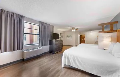 a hotel room with a bed and a television at Extended Stay America Premier Suites - Fort Lauderdale - Convention Center - Cruise Port in Fort Lauderdale