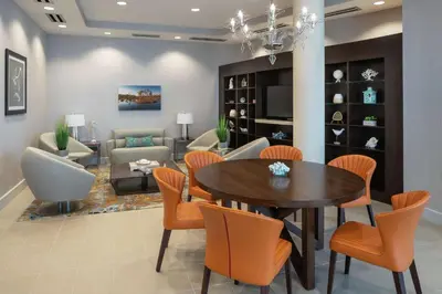 a dining room with a table and chairs at DoubleTree by Hilton Miami Doral in Miami