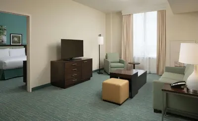 a hotel room with a bed and a television at DoubleTree by Hilton Miami Doral in Miami
