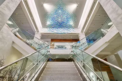 a staircase in a building with a christmas tree at Bahia Mar Fort Lauderdale Beach - DoubleTree by Hilton in Fort Lauderdale