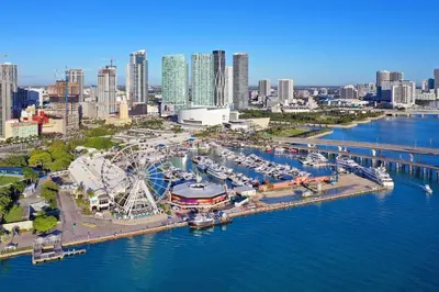 an aerial view of a marina with boats in the water at The Marlin Rooster Apartments in Miami