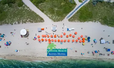 an aerial view of a beach with a resort at Crystal Beach Suites Miami Oceanfront Hotel in Miami Beach