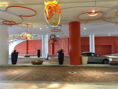 a parking lot with potted plants and chandeliers at Rent in LYFE Resort in Hollywood