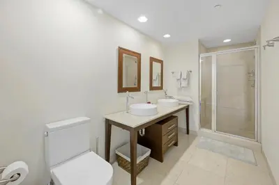 a bathroom with a toilet and a sink and a shower at ICON Brickell residences in Miami