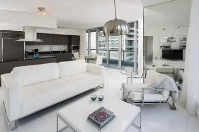 a living room with a white couch and a table at ICON Brickell residences in Miami