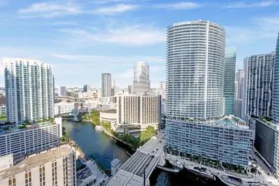 a view of a city with a river and buildings at ICON Brickell residences in Miami