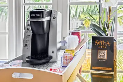 a coffee maker on top of a table at The Fairwind Hotel in Miami Beach