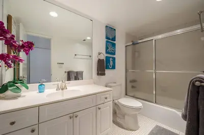 a bathroom with a sink and a toilet and a shower at Ocean Reserve Condominium in Miami Beach
