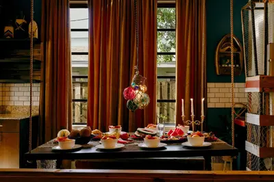 a table with a bunch of food on it at The Captain's Quarters - Home & Guesthouse in Fort Lauderdale