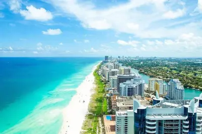 an aerial view of a beach and the ocean at Signature Suite at Four Seasons Residences - Limited Time Offer in Miami