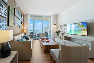 a living room with a couch and a table at Lyfe Residence Building - Private apts over the beach in Hollywood