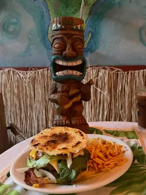 a plate of food with a sandwich and french fries at Habitación Céntrica calle 8 Miami in Miami