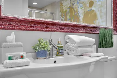 a bathroom sink with a mirror and towels on it at Luxury Waterfront Condo In The Urban Oasis At Icon-Brickell Free Spa in Miami