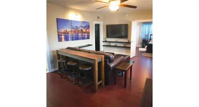 a living room with a couch and a table at Modern 2/1 Apt near Midtown and Beaches in Miami