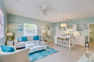 a living room with a couch and a table at A Suite Retreat in Miami