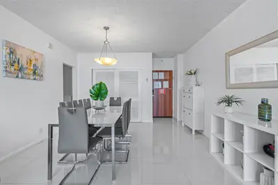 a dining room with a table and chairs at Great Apartment with beach access in Hollywood