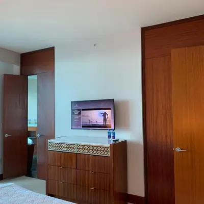 a room with a flat screen tv on a wall at One Bal Harbour Ritz Bal Harbour in Miami Beach